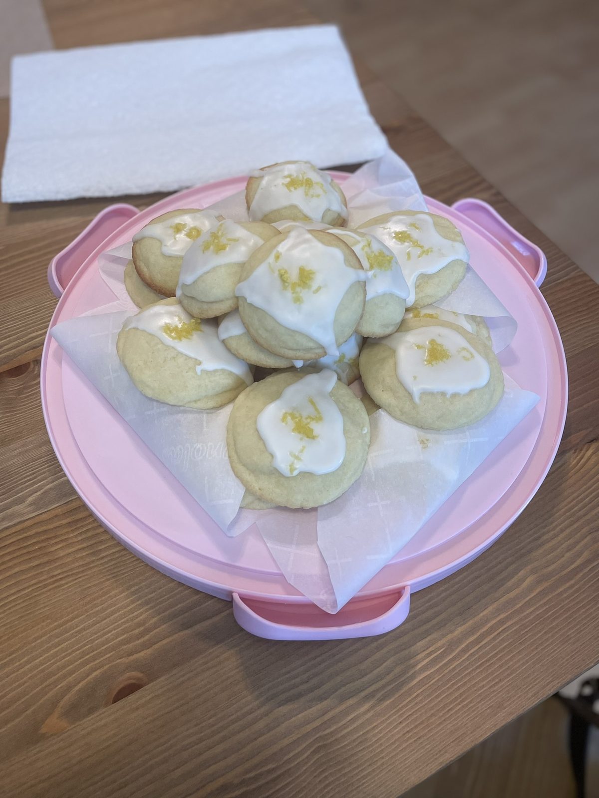 Glazed lemon cookies finished with fresh lemon zest